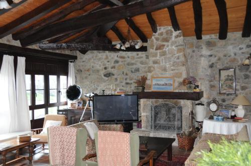 TV a/nebo společenská místnost v ubytování La Casona de los Nonos