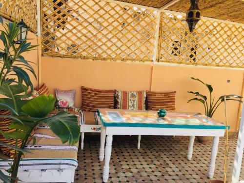 a gazebo with a table and a couch at Dar Saray in F&egrave;s