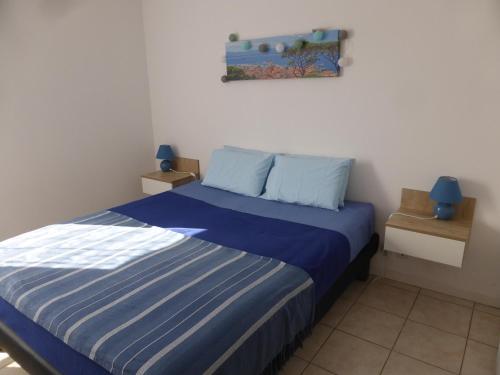 Un pat sau paturi într-o cameră la Drissia&Othman Bella Vista