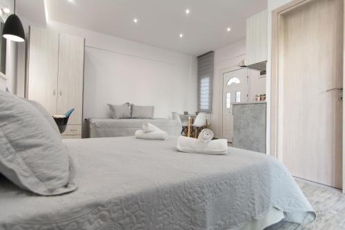 Posteľ alebo postele v izbe v ubytovaní Skalidis Apartments Stalis