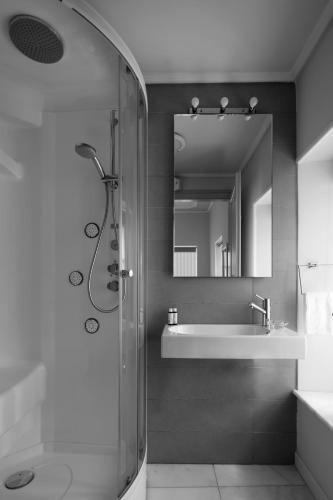 a bathroom with a shower and a sink at Hydras Chromata in Hydra