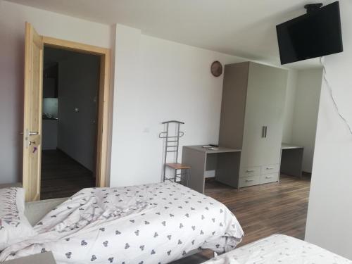 TV a/nebo společenská místnost v ubytování ROSTICAFFE'