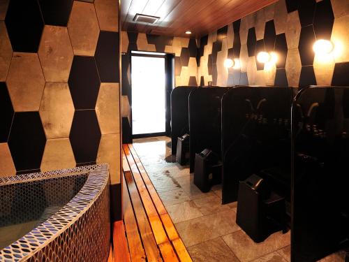 a room with a row of chairs and a window at Hakodate Onuma Tsuruga Resort EPUY- 30km from Hakodate Station in Hakodate