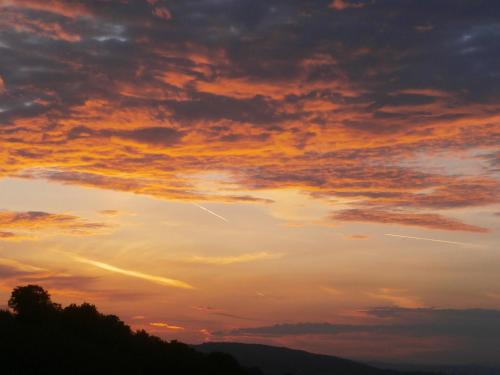 a sunset in the sky with clouds at Tenuta Colverano in Montefalco