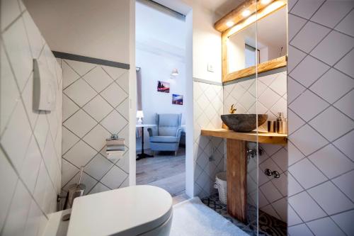 a bathroom with a toilet and a sink at Casa Colloredo Free Parking in Rovinj