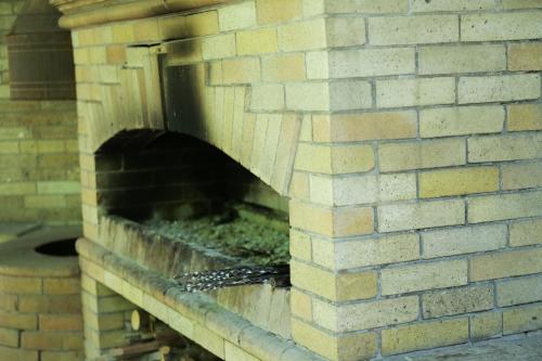 a bird is sitting in a brick wall at Red Hotel Yerevan Center in Yerevan