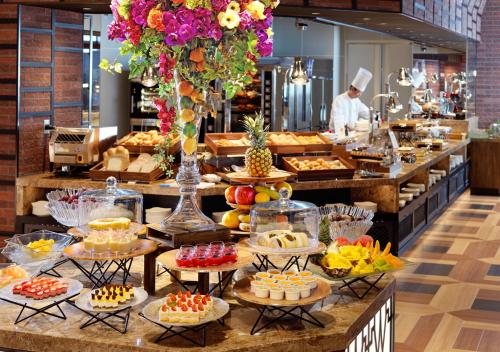 a buffet line with many different types of desserts at HOTEL＆SPA CENTURY MARINA HAKODATE in Hakodate