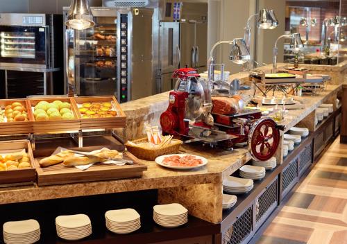a buffet line with food on display in a restaurant at HOTEL＆SPA CENTURY MARINA HAKODATE in Hakodate