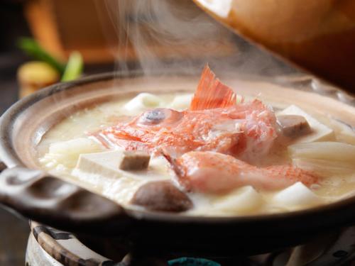a bowl of soup with seafood on top of pasta at Akan Tsuruga Besso Hinanoza in Akankohan