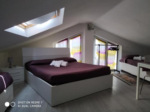 Łóżko lub łóżka w pokoju w obiekcie B&B Residenza Leonardo
