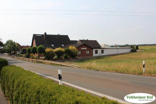 a road with houses on the side of the road at Landgasthaus Veltheimer Hof in Porta Westfalica