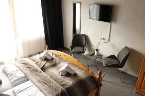 TV a/nebo společenská místnost v ubytování Gasthof Draxlerhaus