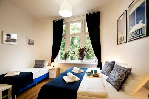Säng eller sängar i ett rum på Monte Cassino Apartments
