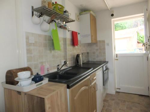 a kitchen with a sink and a counter top at Saurden Guest Apartment in Ipswich
