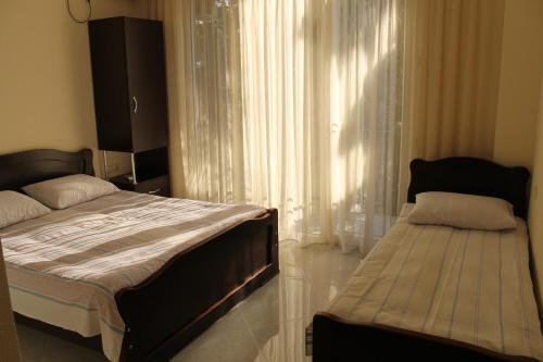 Postel nebo postele na pokoji v ubytování KUKARACHA
