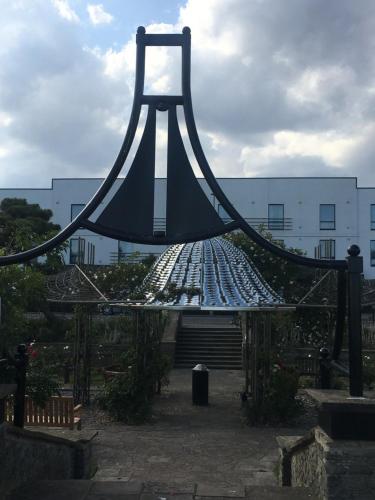a large metal structure with a bridge in front of a building at The Grosvenor in Clacton-on-Sea