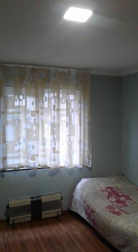 Ein Bett oder Betten in einem Zimmer der Unterkunft Guest Houze Nona