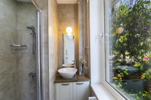 a bathroom with a sink and a shower at Larnaca Villa Marisol Kiti in Larnaka