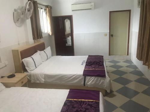 A bed or beds in a room at Don Bosco Guesthouse