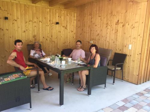 a group of people sitting at a table at Appart Gfall in Ried im Oberinntal