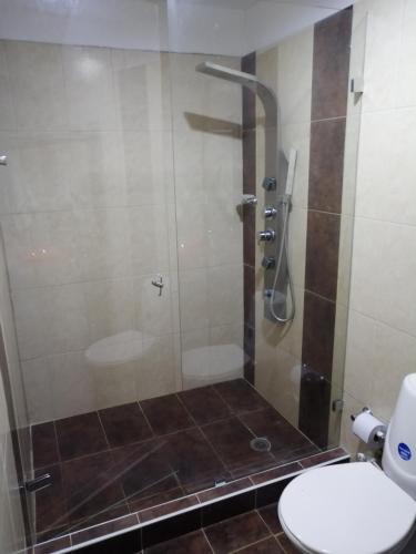 a bathroom with a shower with a toilet in it at Casa Campestre Rivera in Rivera