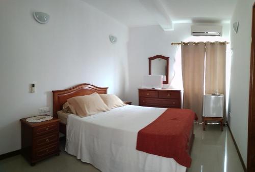 Postel nebo postele na pokoji v ubytování Residencial Vitoria