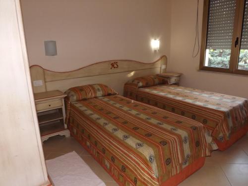Postel nebo postele na pokoji v ubytování Hotel Sagittario