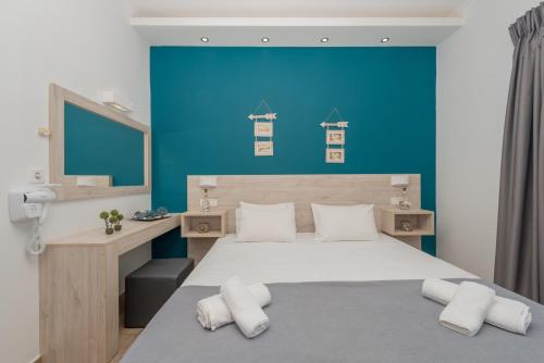 Postel nebo postele na pokoji v ubytování Stathis Studios I