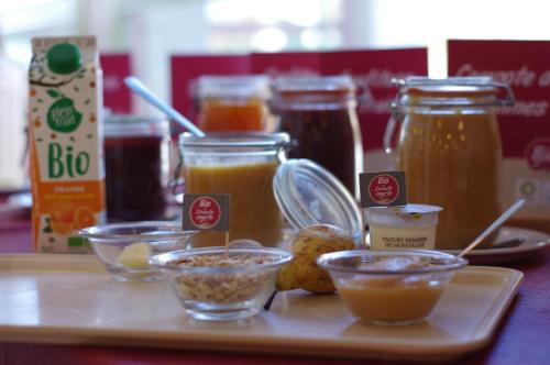 a tray with various jars of honey and other condiments at CIS-Ethic Etapes de Val Cenis in Lanslebourg-Mont-Cenis