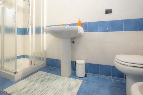 a bathroom with a sink and a toilet at Venere Paolina - Goelba in Marciana