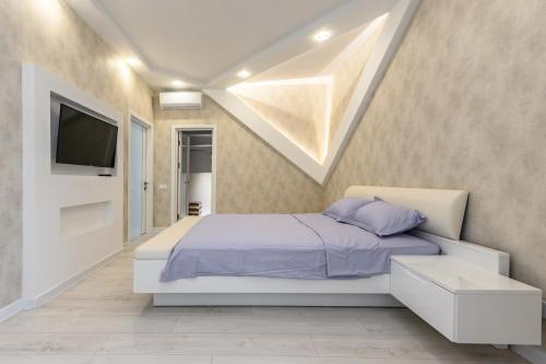 Ένα ή περισσότερα κρεβάτια σε δωμάτιο στο Апартаменты с террасой 80 м в Аркадии