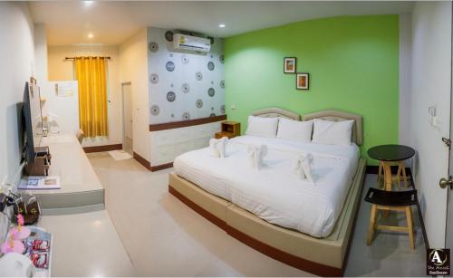 Giường trong phòng chung tại The Areaac