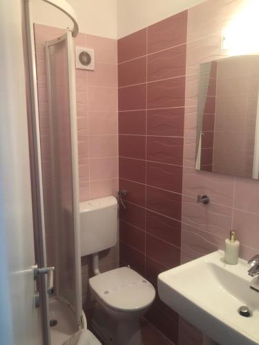 a bathroom with a toilet and a sink at Casa di Lavanda in Hvar