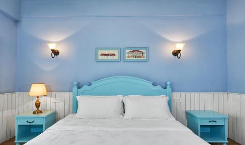 Postel nebo postele na pokoji v ubytování Memory Inn Guilin Central