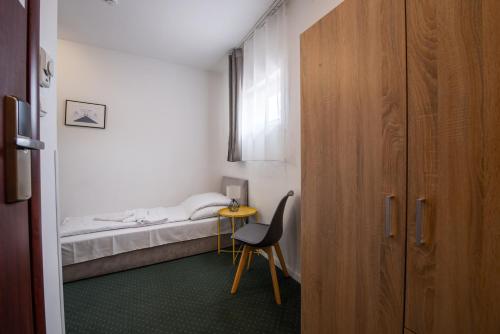 Postel nebo postele na pokoji v ubytování Hotel Chesscom