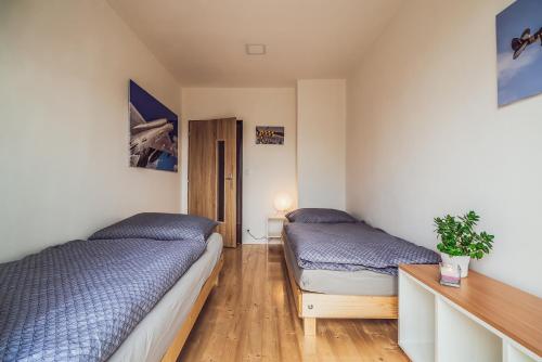 Posteľ alebo postele v izbe v ubytovaní Skodova Apartments