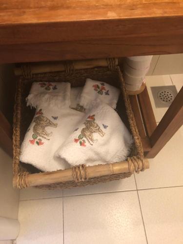 a basket filled with towels under a table at Casa di Lavanda in Hvar