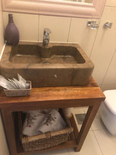 a sink on a wooden table in a bathroom at Casa di Lavanda in Hvar