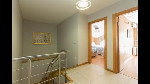 a hallway with a staircase in a house at CTS Elysium Residence Taksim in Istanbul