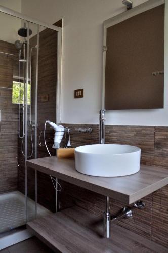 a bathroom with a white sink and a shower at Casa Rosetta in Palermo
