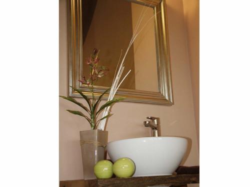 a bathroom with a white sink and a mirror at Hotel Zur Post in Roßbach