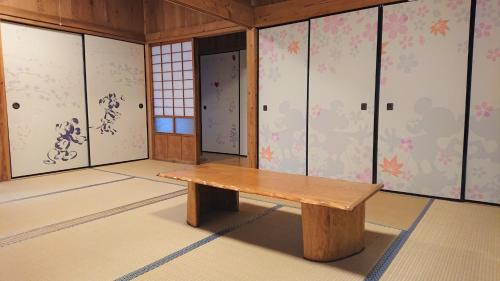 a room with a wooden bench in a room at Kumage-gun - House / Vacation STAY 39331 in Miyanoura