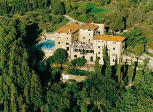a large house with trees and houses at Villa Schiatti in Cortona