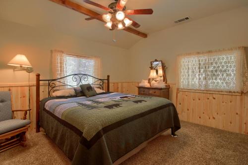 a bedroom with a bed and a ceiling fan at 43R Edna's Hearts Desire in North Wawona