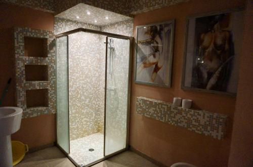 a bathroom with a shower with a glass door at Elite Apartments in Sunny Beach