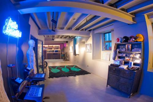 a living room with blue walls and a ceiling at Raw Culture Art & Lofts Bairro Alto in Lisbon