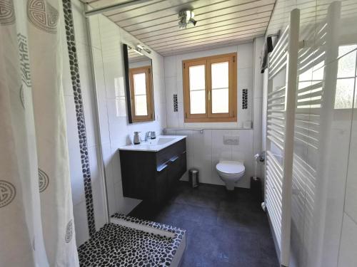 Koupelna v ubytování Apartments Chalet Tatyana