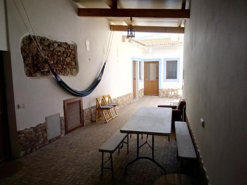 a room with tables and chairs in a building at O Nosso Lar in Lagos