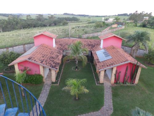 an aerial view of a house with pink roofs at HOTEL ABAPORU in Adamantina
