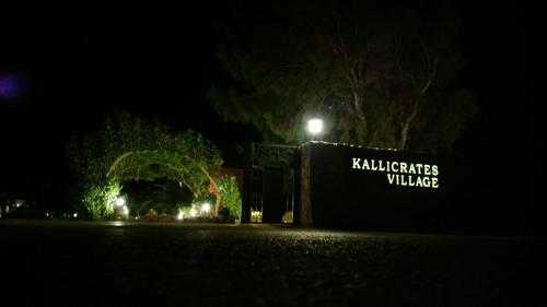 a sign for avillages village at night at Kallicrates Village in Frangokastello